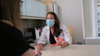 Doctor speaks with patient